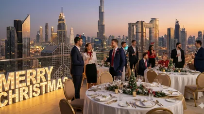 Winter Wonderland Christmas corporate party in Dubai desert with snow-effect décor, fairy lights, and employees celebrating